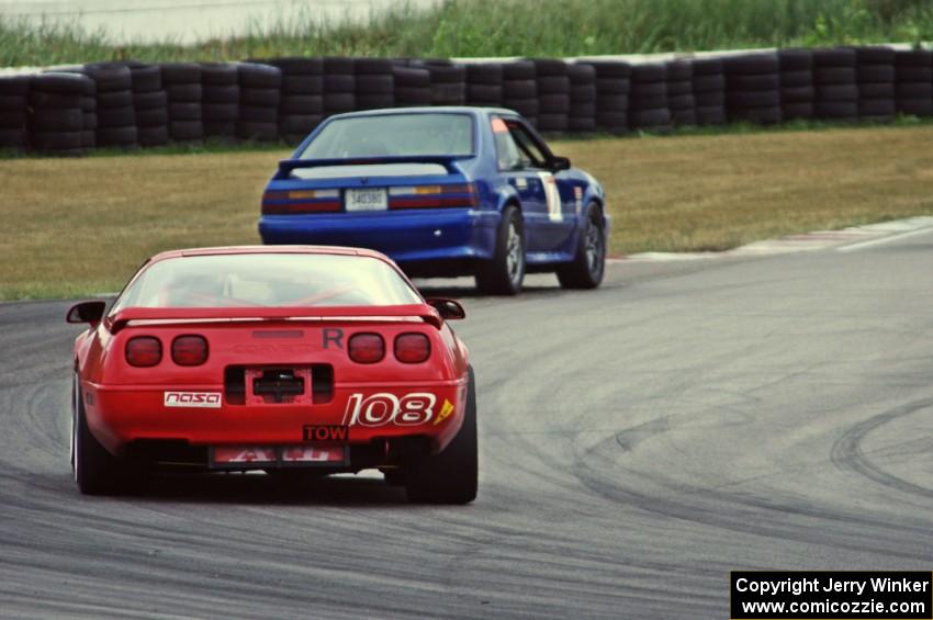 Chris Johnson's ITE-1 Chevy Corvette chases Damon Bosell's ITE-1 Ford Mustang