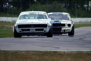 Shannon Ivey's Chevy Camaro leads Brian Kennedy's Ford Shelby GT350 into turn 12