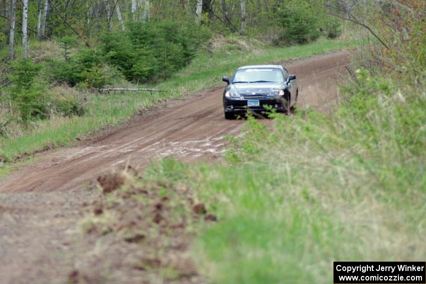 Derek McCorison / Paul Johansen at speed in their Hyundai Tiburon on their first ever stage.