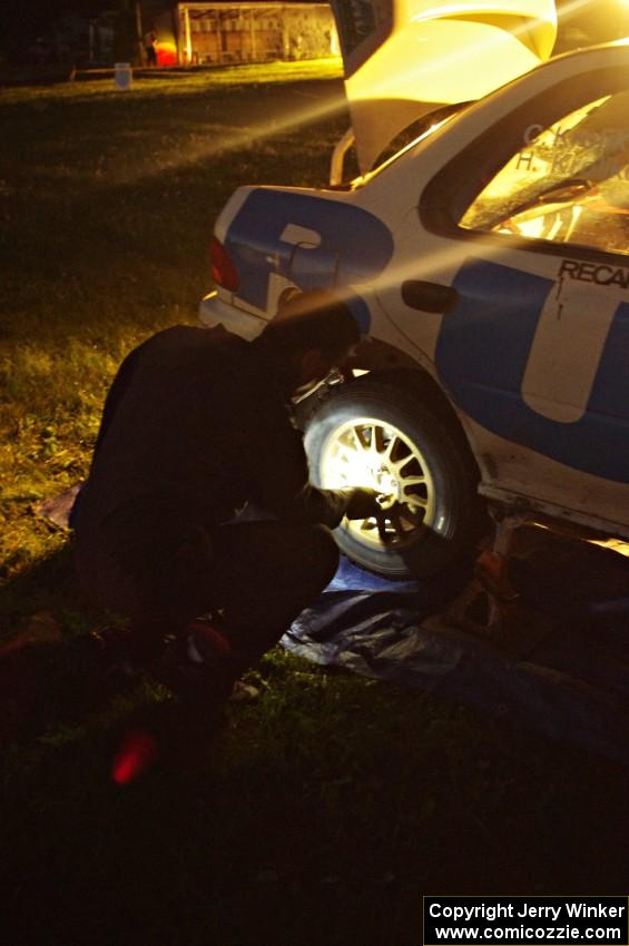 Al Kaumeheiwa works on the Henry Krolikowski / Cindy Krolikowski Subaru WRX at service.