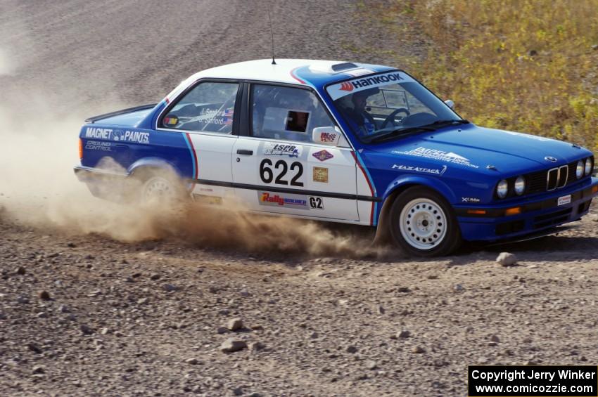 Scott Sanford / Joel Sanford in their BMW 325i on SS1 (Green Acres I)