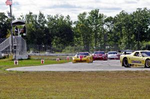 1. Doug Peterson, 2. Tony Ave, 3. Amy Ruman and 4. Simon Gregg, all in Chevy Corvettes.