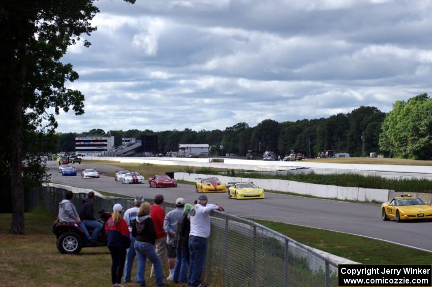 The field bunches up behind the pace car after Chuck Cassaro's wreck.