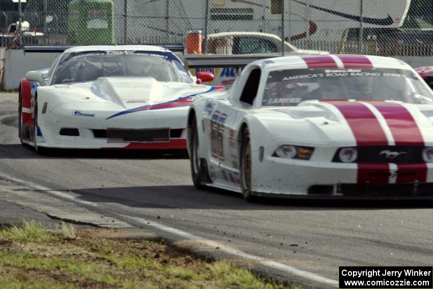 Cliff Ebben's Ford Mustang ahead of Simon Gregg's Chevy Corvette