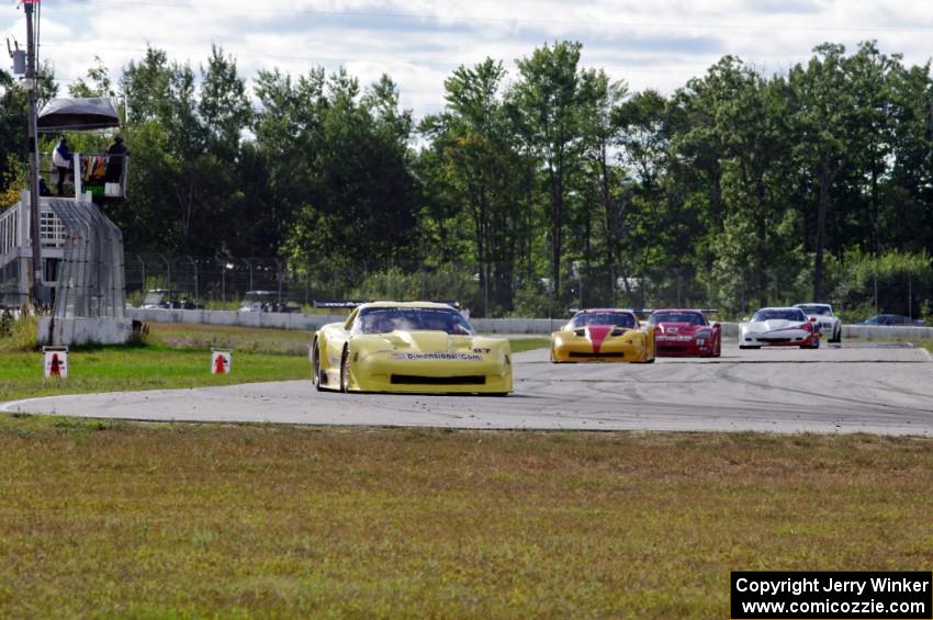 1. Doug Peterson, 2. Tony Ave, 3. Amy Ruman and 4. Simon Gregg, all in Chevy Corvettes.