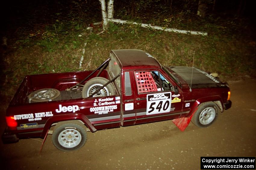 Scott Carlborn / Jim Konkler Jeep Comanche at speed on SS8, Kabekona.