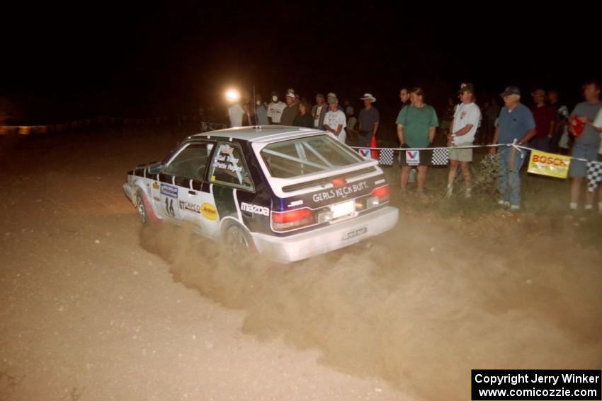 Gail Truess / Pattie Hughes Mazda 323GTX at the spectator corner on SS9, Limestone II.