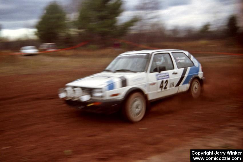 Eric Burmeister / Mark Buskirk VW GTI at speed on the practice stage.