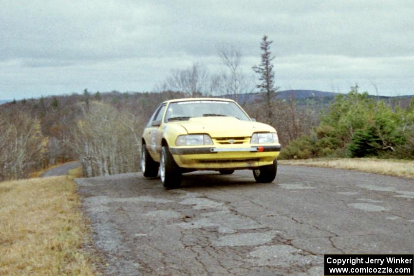 Don Rathgeber / D.J. Bodnar Ford Mustang at the final yump on SS14, Brockway Mountain I.