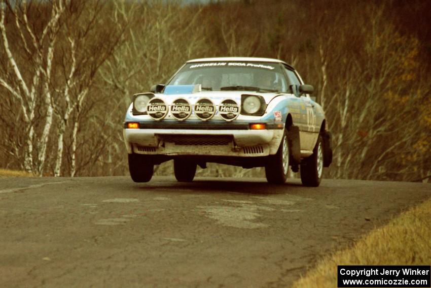 Mike Hurst / Rob Bohn Mazda RX-7 at the final yump on SS14, Brockway Mountain I.