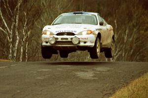 Paul Choiniere / Jeff Becker Hyundai Tiburon at the final yump on SS14, Brockway Mountain I.