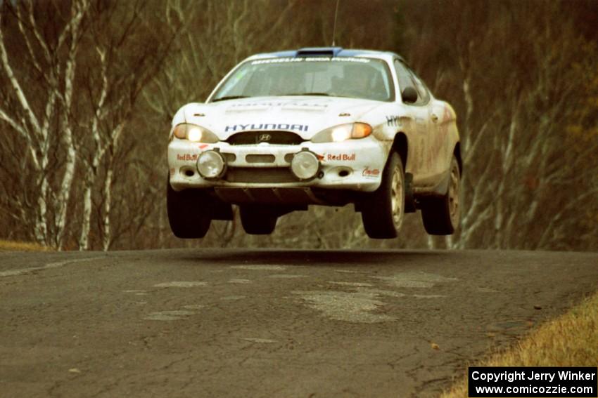 Paul Choiniere / Jeff Becker Hyundai Tiburon at the final yump on SS14, Brockway Mountain I.