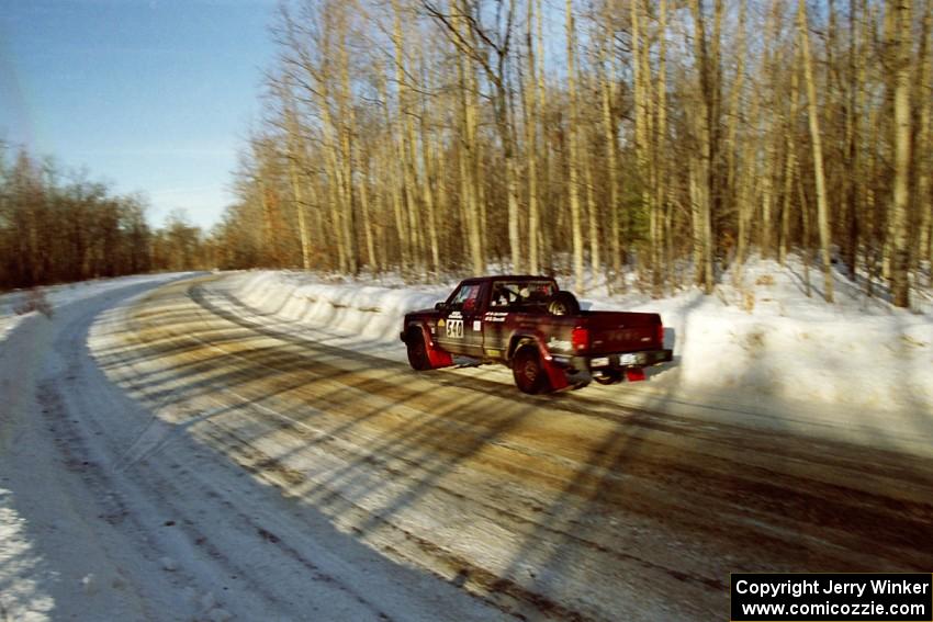 Scott Carlborn / Dale Dewald drift through a fast sweeper on SS9, Avery Lake II, in their Jeep Comanche.