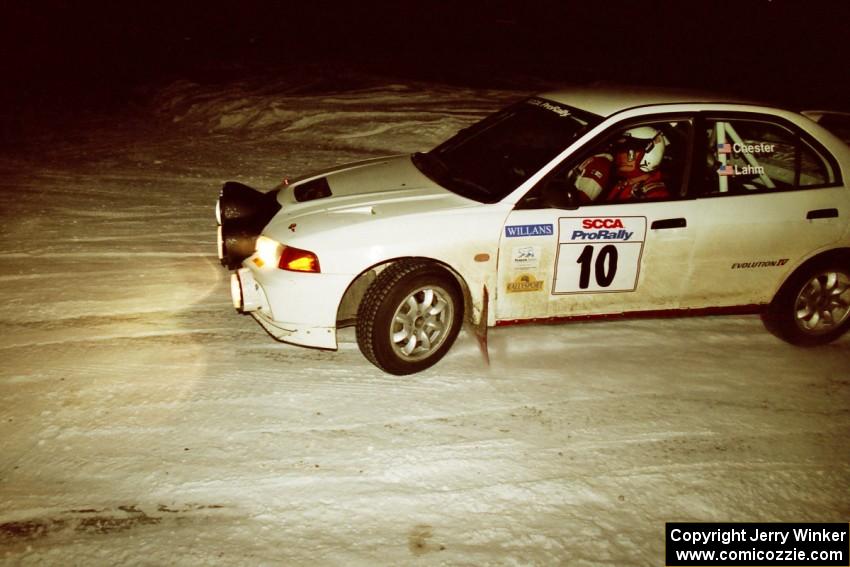 Pete Lahm / Matt Chester drift their Mitsubishi Lancer Evo IV through a 90-left on SS16, the final stage.