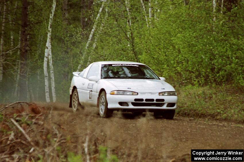 Chris Gilligan / Joe Petersen at speed over a blind crest in the Two Inlets State Forest in their Mistubishi Eclipse GSX.