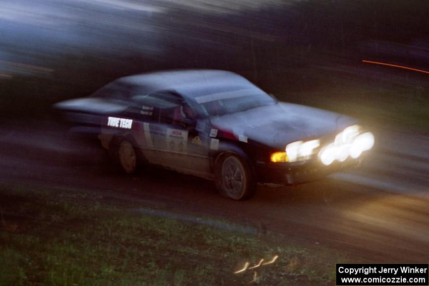 The Mike Hurst / Rob Bohn Pontiac Sunbird Turbo at speed at the crossroads.