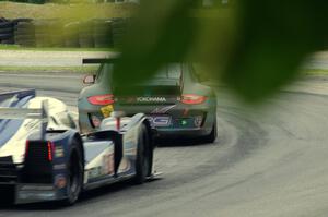 Jeff Courtney / Madison Snow Porsche GT3 Cup chased by Chris McMurry / Tony Burgess Lola B12/60 Mazda