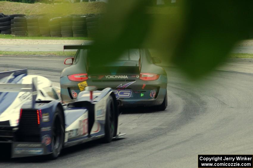 Jeff Courtney / Madison Snow Porsche GT3 Cup chased by Chris McMurry / Tony Burgess Lola B12/60 Mazda