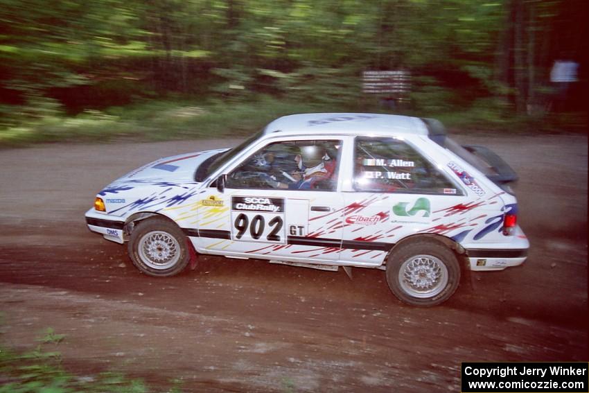 Marty Allen / Peter Watt Mazda 323GTX at the first hairpin on SS8, Rim Stock.