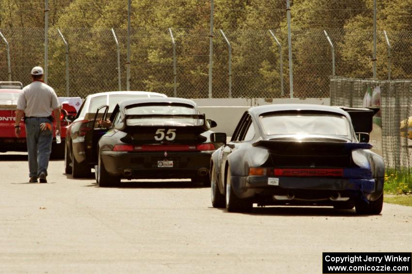 Tom Fuehrer's SPO Ford Mustang, Phil Magney's ITE-1 Porsche 993 and Craig Stephens' ITE-1 Porsche 911 on the pre-grid.