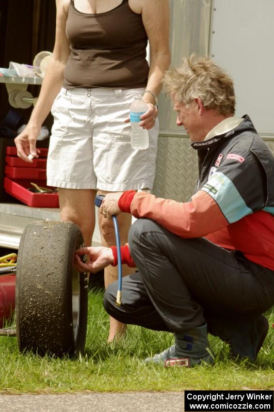 Steve Barkley checks tire pressures on his Euroswift SE-1 Formula Ford.