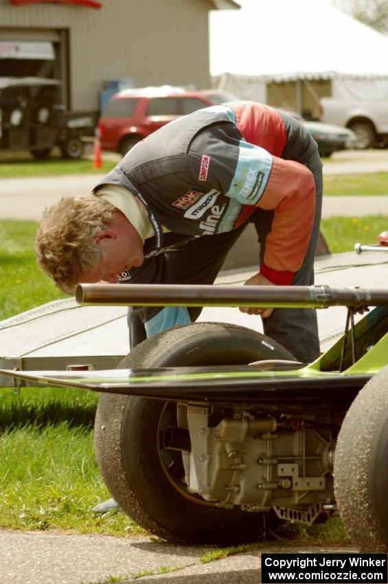 Steve Barkley checks tire pressures on his Euroswift SE-1 Formula Ford.