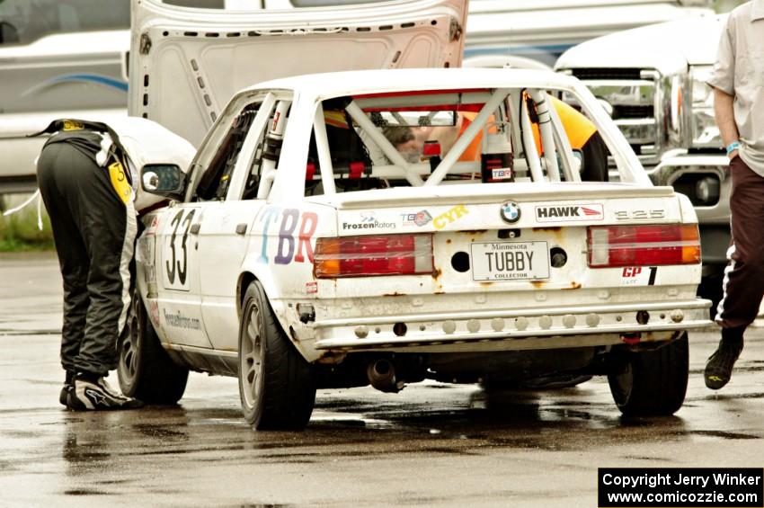 Tubby Butterman Racing 2 BMW 325 in the paddock for a lengthy stop.