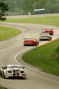 Cameron Lawrence's and Adam Andretti's Chevy Camaros followed by Ron Keith's and Joe Ebben's Ford Mustangs