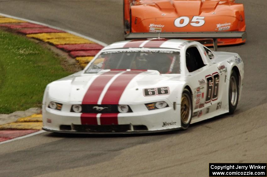 Denny Lamers' Ford Mustang and David Fershtand's Chevy Corvette