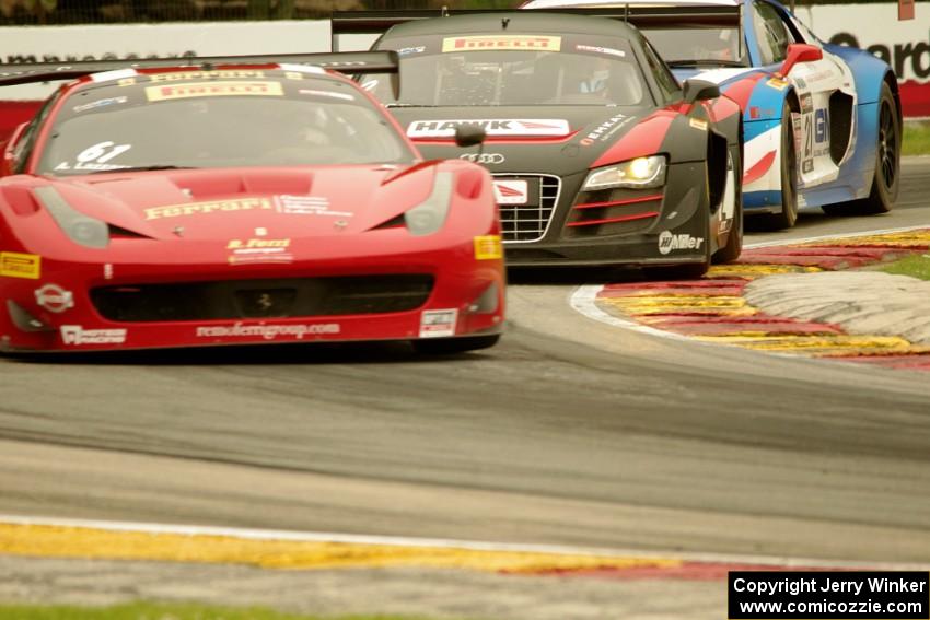 Anthony Lazzaro's Ferrari 458 Italia GT3, and Mike Skeen's and Andrew Palmer's Audi R8 Ultras