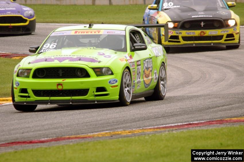 Brad Adams' Ford Mustang Boss 302S, Jack Roush, Jr.'s Ford Mustang Boss 302S and Mark Klenin's Aston Martin Vantage GT4