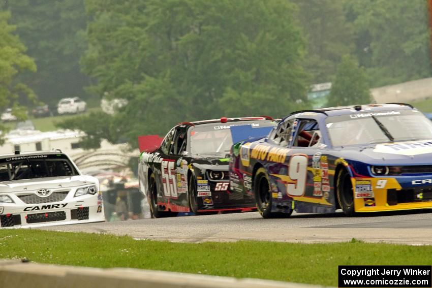 Chase Elliott's Chevy Camaro, Andy Lally's Chevy Camaro and Mike Bliss' Toyota Camry