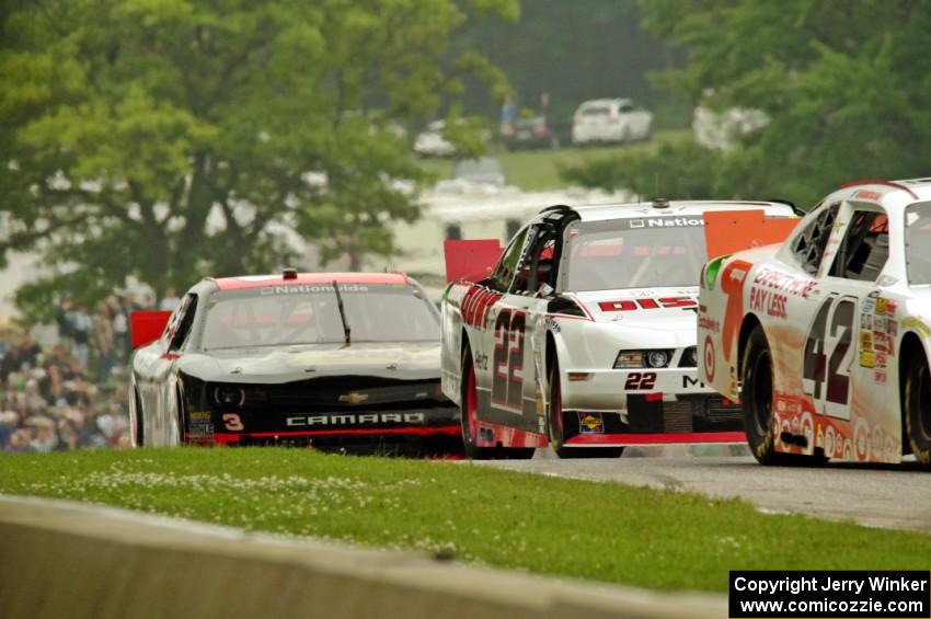 Dylan Kwasniewski's Chevy Camaro, Alex Tagliani's Dodge Challenger and Ty Dillon's Chevy Camaro