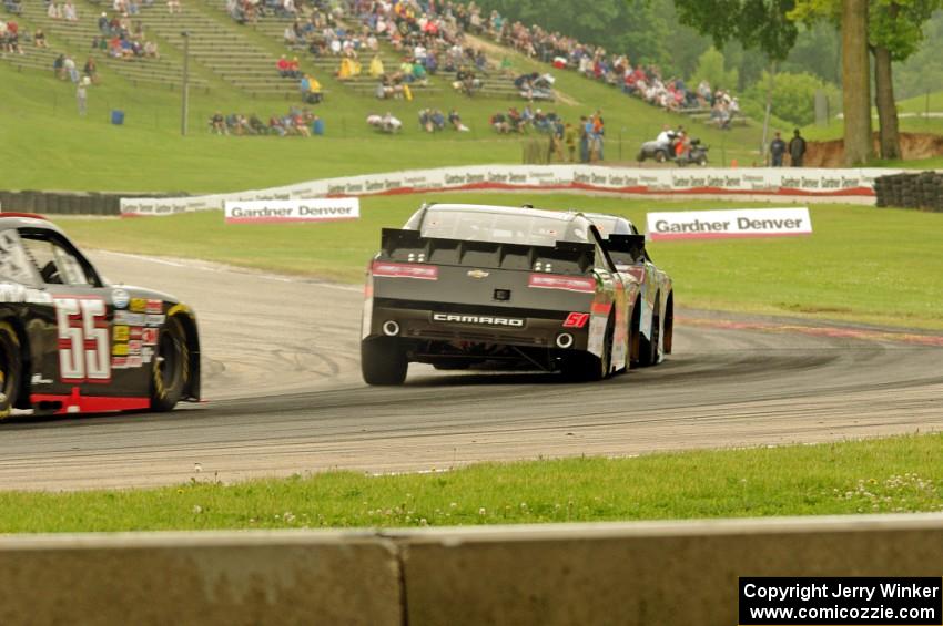 Elliot Sadler's Toyota Camry, Jeremy Clements' Chevy Camaro and Andy Lally's Chevy Camaro