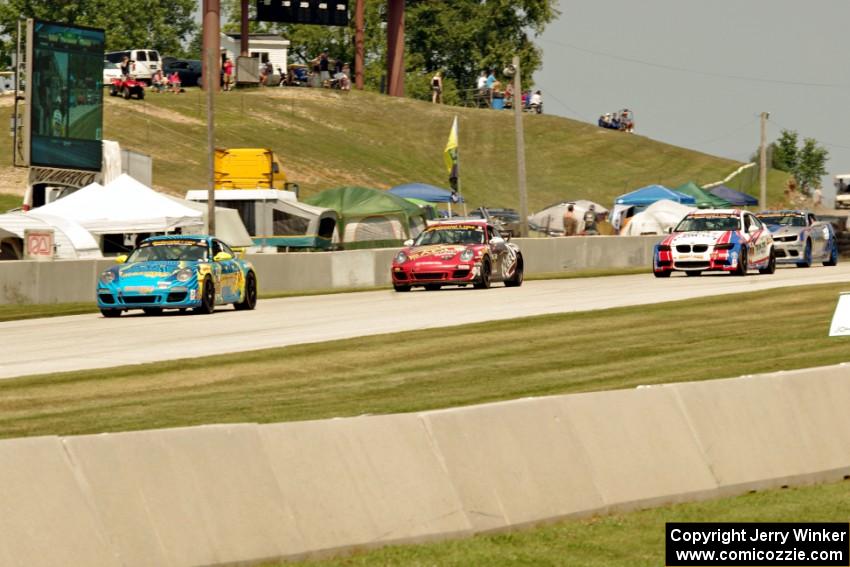 Matt Plumb / Nick Longhi Porsche 997 leads the field into turn 8.