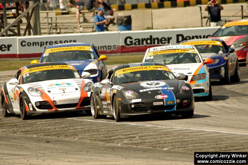 Cody Ellsworth / Corey Lewis Porsche Cayman leads ST late in the race.