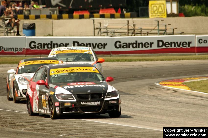 Dan Rogers / Seth Thomas BMW 328i, Cory Friedman / Mac McGehee Porsche Cayman and Ted Giovanis / David Murry BMW 328i