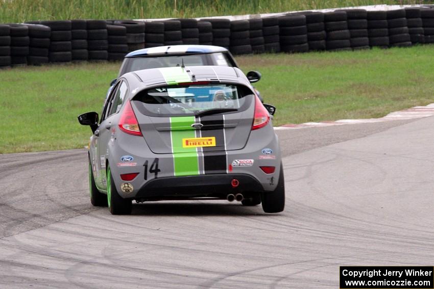 Nate Stacy's Ford Fiesta chases Tyler Palmer's MINI Cooper