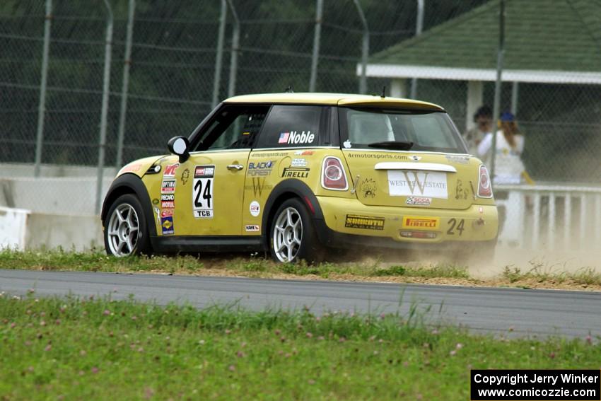 Tom Noble's MINI Cooper goes off the high side of turn 4