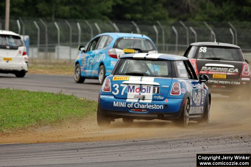 Tyler Palmer's MINI Cooper chases three other cars in the TCB class