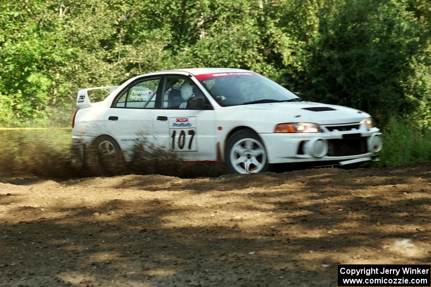 Tim Paterson / Scott Ferguson Mitsubishi Lancer Evo IV at the spectator corner on SS10, Kabekona.