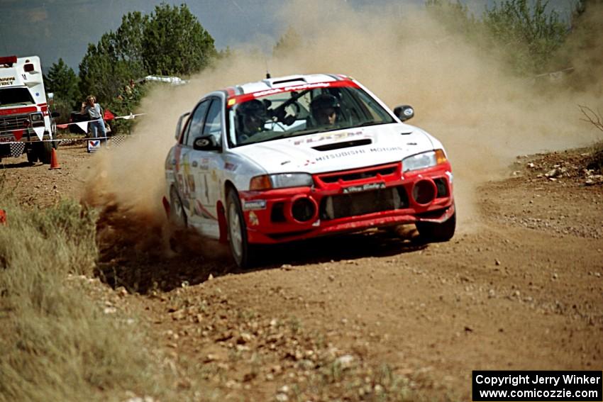 Garen Shrader / Michael Fennell Mitsubishi Lancer Evo IV through the spectator point on SS7.