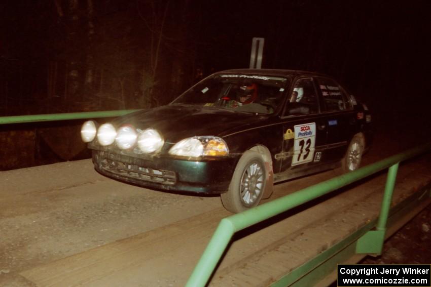 Nick Robinson / Carl Lindquist Honda Civic at speed across the final bridge on SS10, Menge Creek.