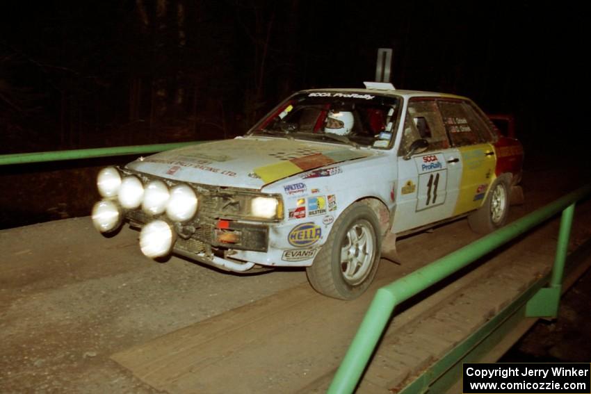 Ivan Orisek / Olga Orisek Audi 4000 Quattro at speed across the final bridge on SS10, Menge Creek.