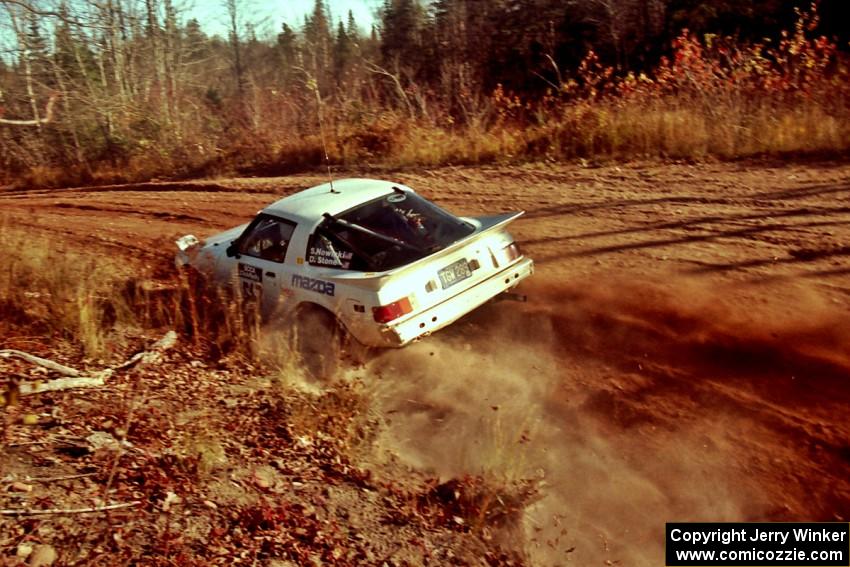 Steve Nowicki / David Stone Mazda RX-7 at speed near the end of SS17, Gratiot Lake II.