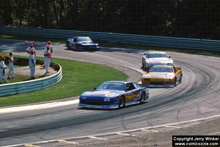 Jack Baldwin's Chevy Camaro, Scott Sharp's Chevy Camaro, Greg Pickett's Chevy Camaro and Ron Fellows' Ford Mustang