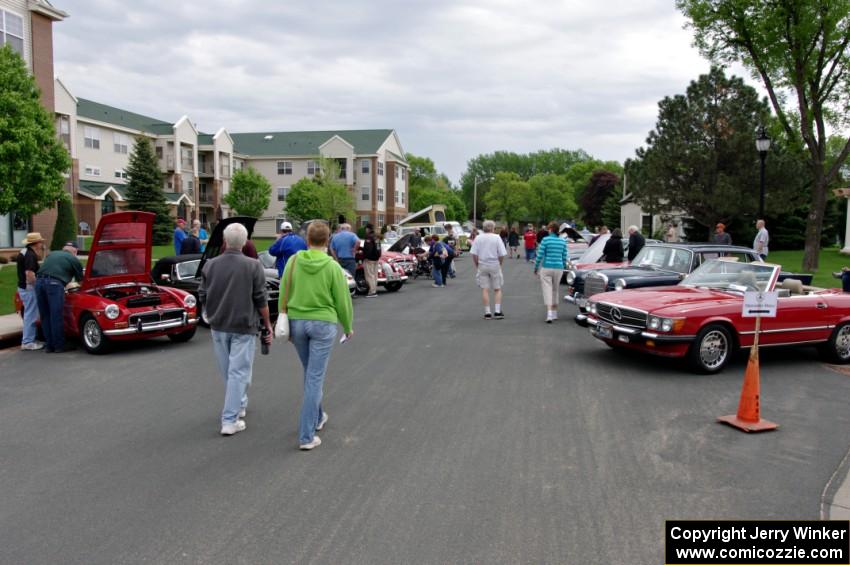 British cars on the left and Mercedes-Benzes on the right.