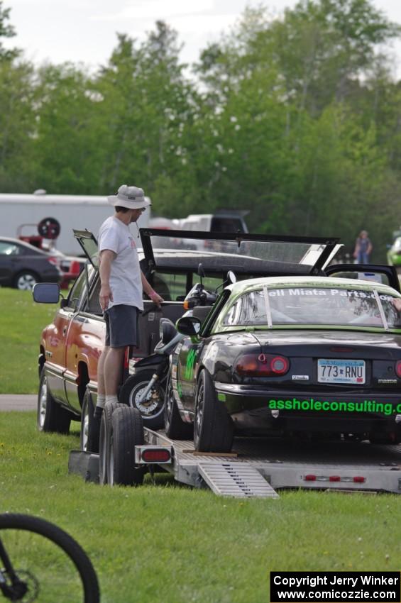 Aaron Jongbloedt's Spec Miata Mazda Miata in the paddock.