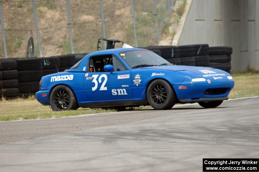 Paul Pridday's Spec Miata Mazda Miata spins coming out of turn 12.