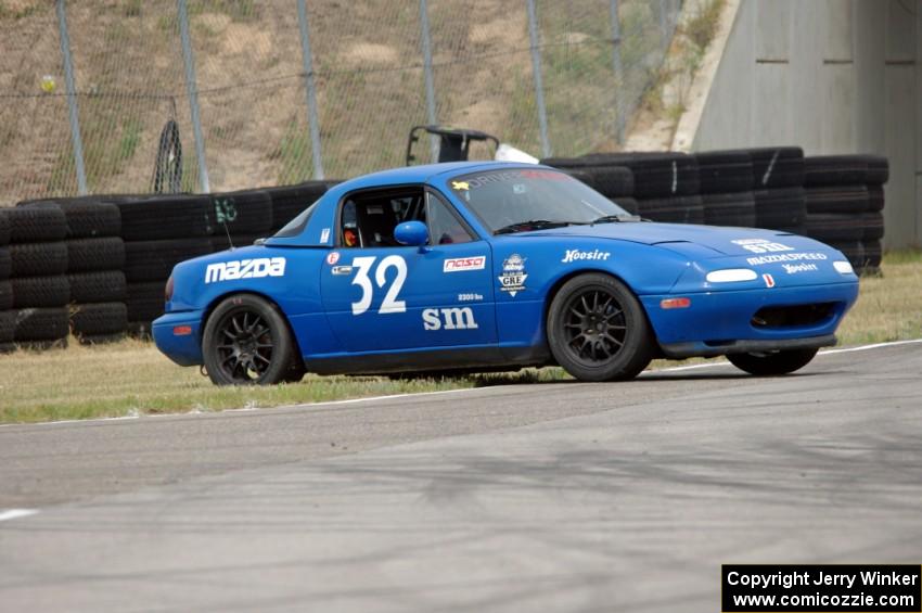 Paul Pridday's Spec Miata Mazda Miata spins coming out of turn 12.